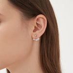 Angel Wing Stud Earrings in silver on ear