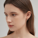 STMG Minimalist Rhombus Stud Earrings on ear