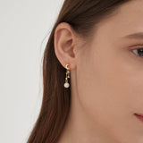 STMG Moon with Stars Pearl Earrings on ear