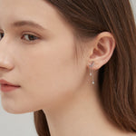 STMG Moon with Star Dangle Earrings in silver on ear