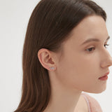 STMG Olive Leaf Stud Earrings in silver on ear