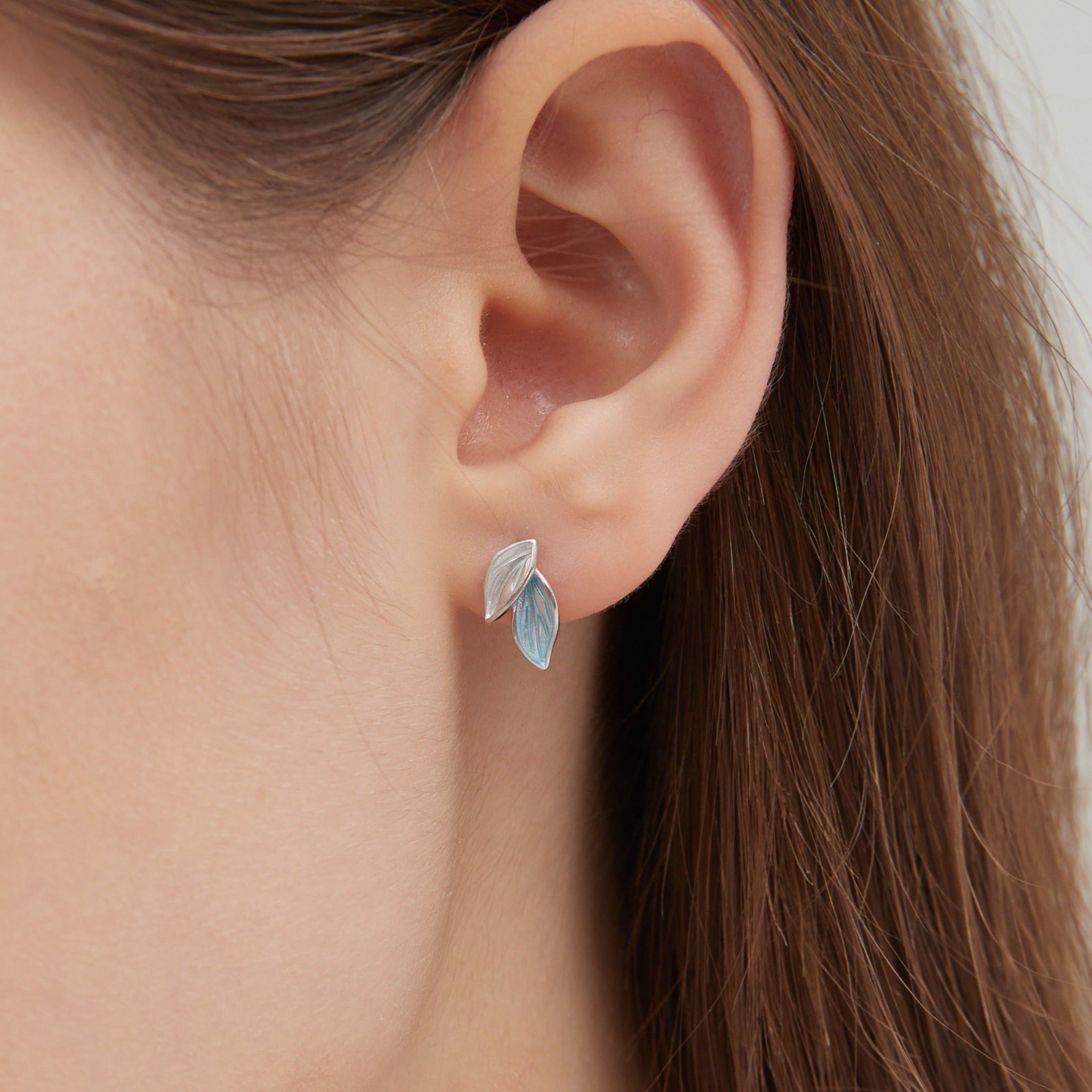 Blue Leaf Stud Earrings in silver on ear