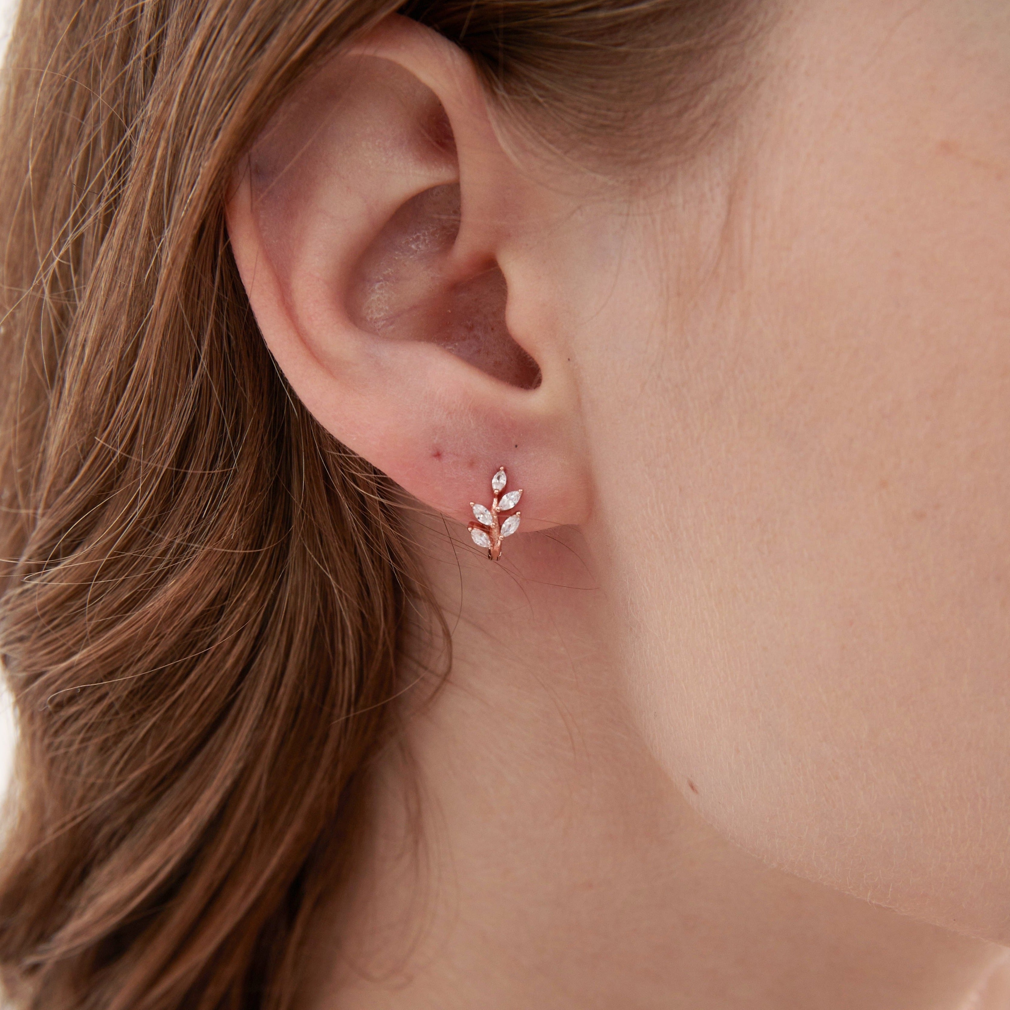 STMG Olive Leaf Hoops in rose gold on ear