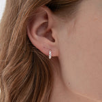 STMG Olive Leaf Hoops in silver on ear