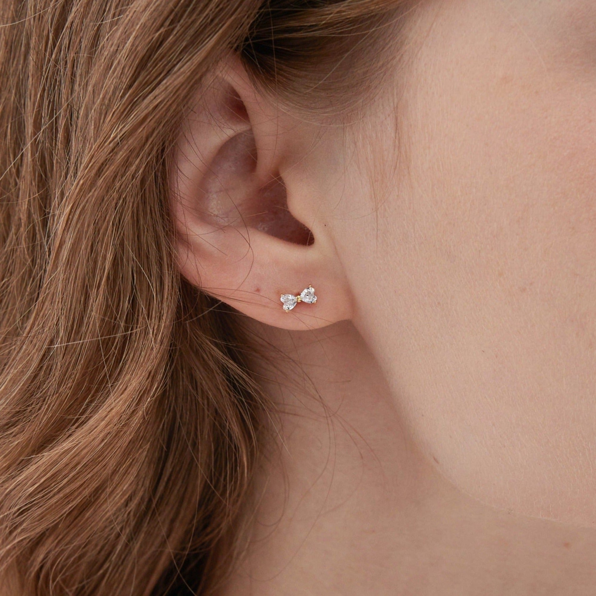 STMG Tiny Bowknot Stud Earrings on ear