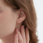 STMG Tiny Bowknot Stud Earrings on ear