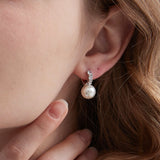 STMG Pearl Dangle Hoops in silver on ear