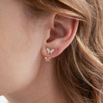 STMG Tiny Butterfly Stud Earrings on ear