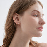 STMG Star Stud Earrings on ear