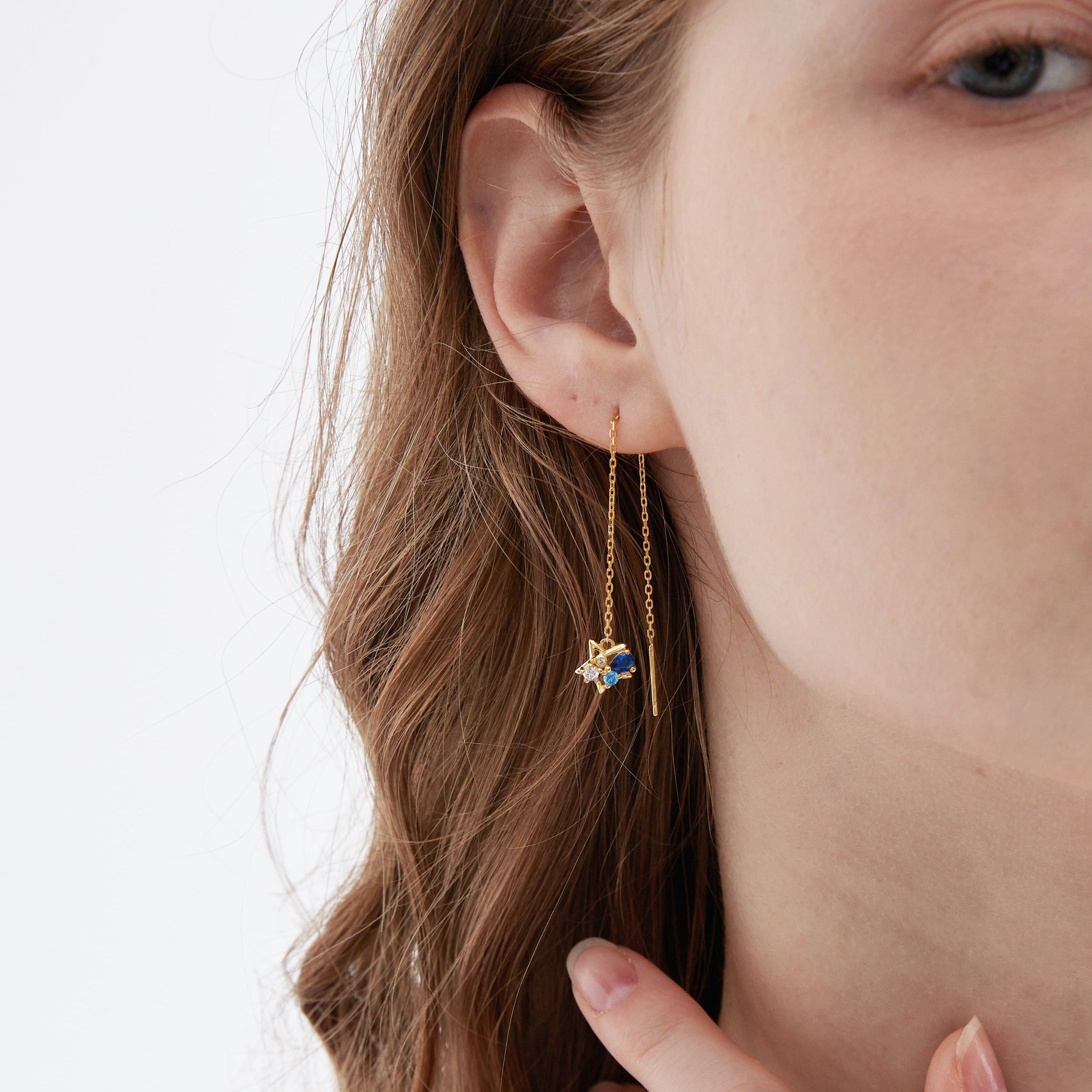 STMG Moon and Star Threader Earrings in gold on ear