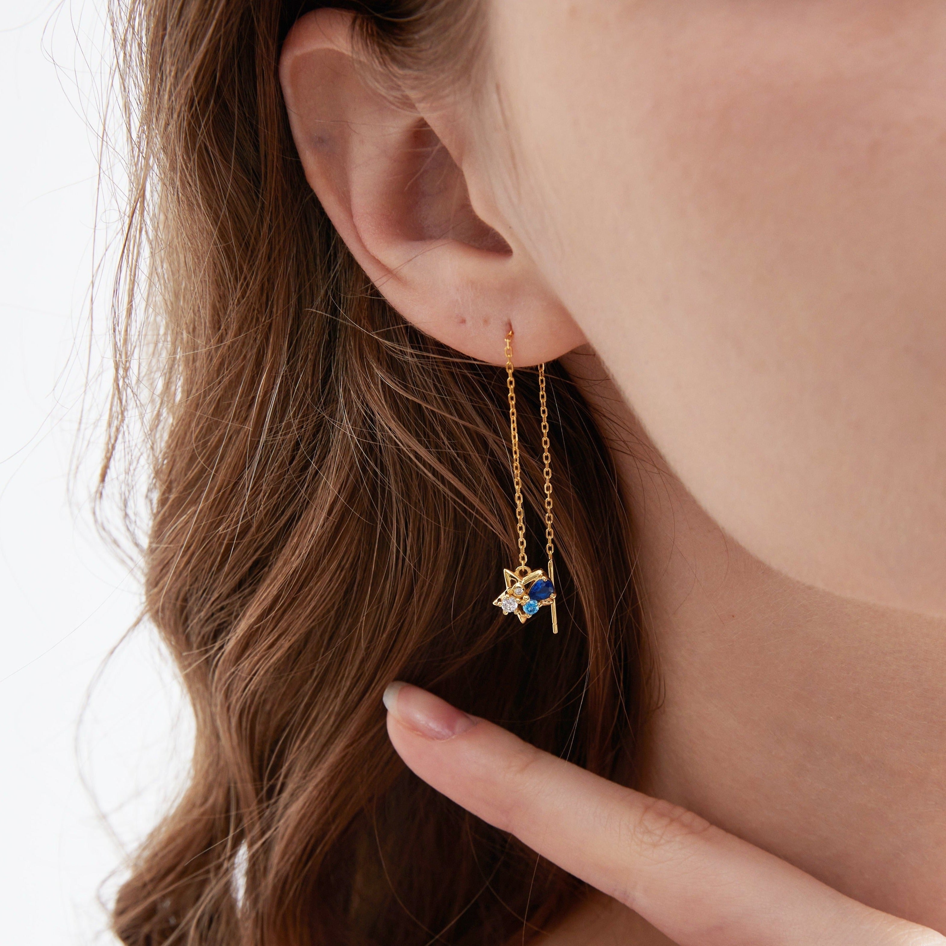 STMG Moon and Star Threader Earrings in gold on ear