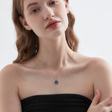 Blue Sandstone Moon Phase Necklace in silver on neck