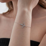 Cupid Bow And Arrow Bracelet in silver on hand