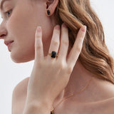 STMG Natural Black Agate Ring with matching earrings on ear