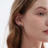 STMG Heart Stud Earrings on ear