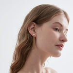 STMG Natural Pearl Tassel Dangle Earrings on ear