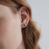 Blue Sapphire Stud Earrings on ear