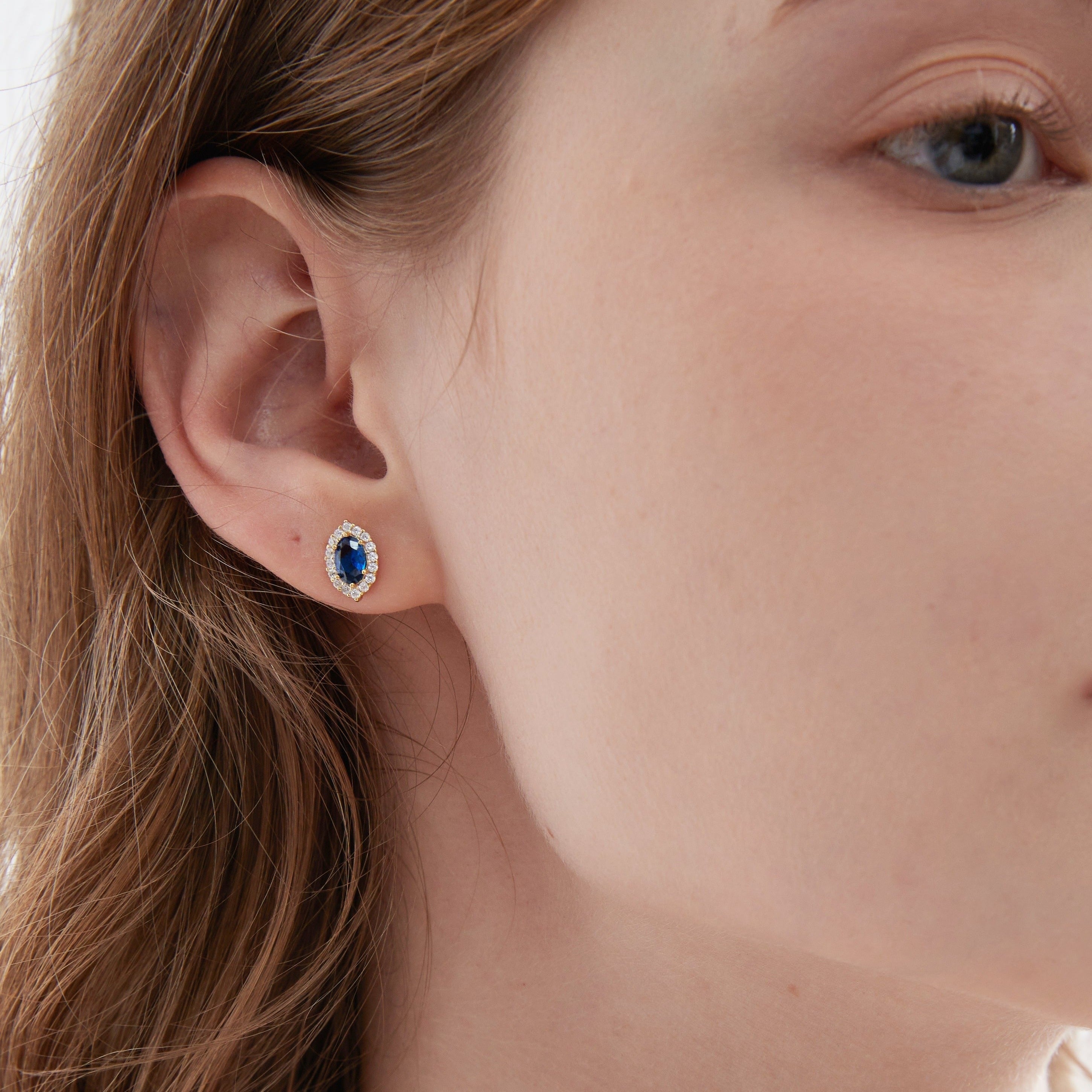 Blue Sapphire Stud Earrings on ear