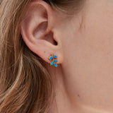 Blue Opal Olive Leaf Stud Earrings on ear