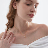 STMG Natural Pearl Necklace on neck with matching earrings on neck