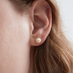 STMG Natural Pearl Stud Earrings on ear