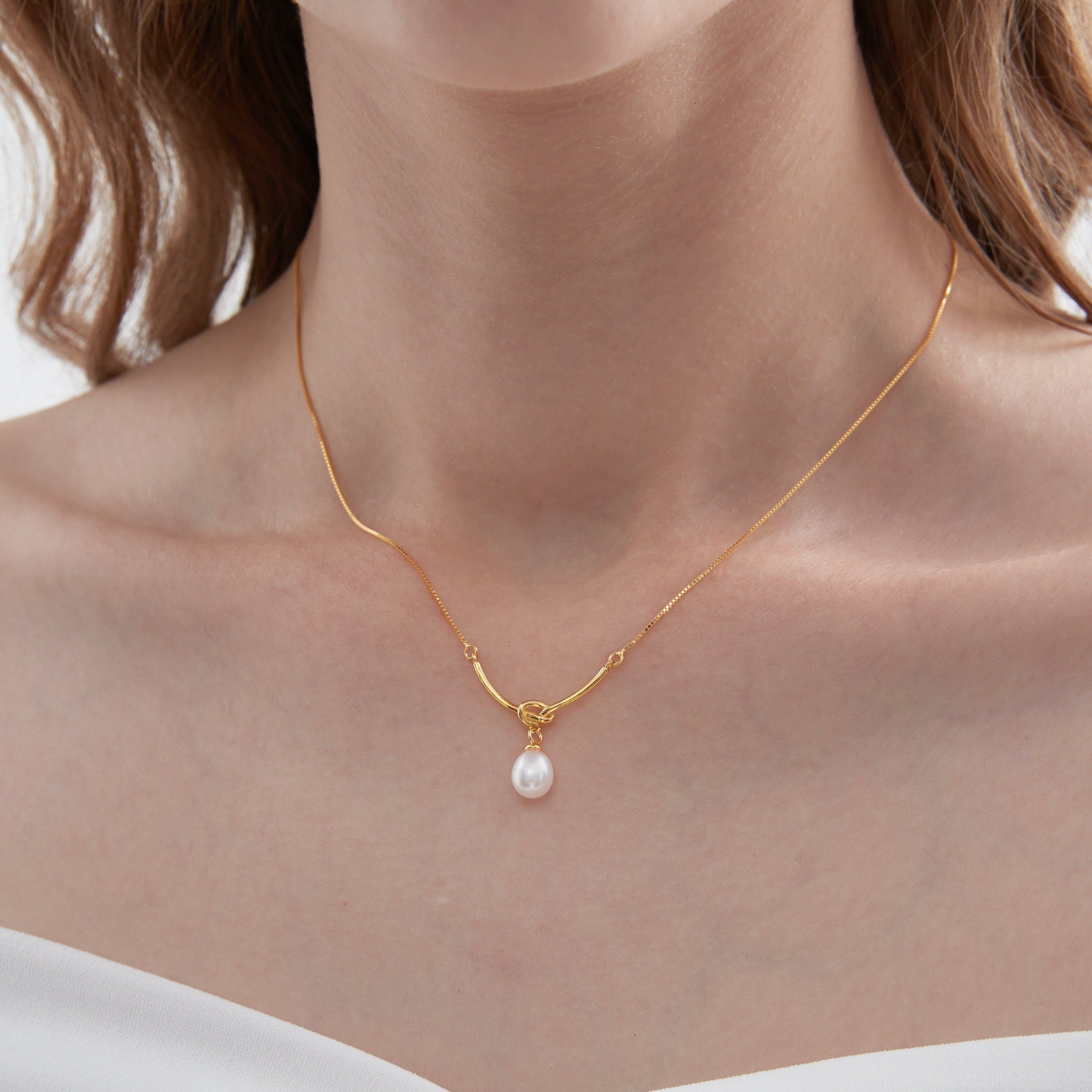 STMG Natural Pearl Knot Necklace in gold on neck