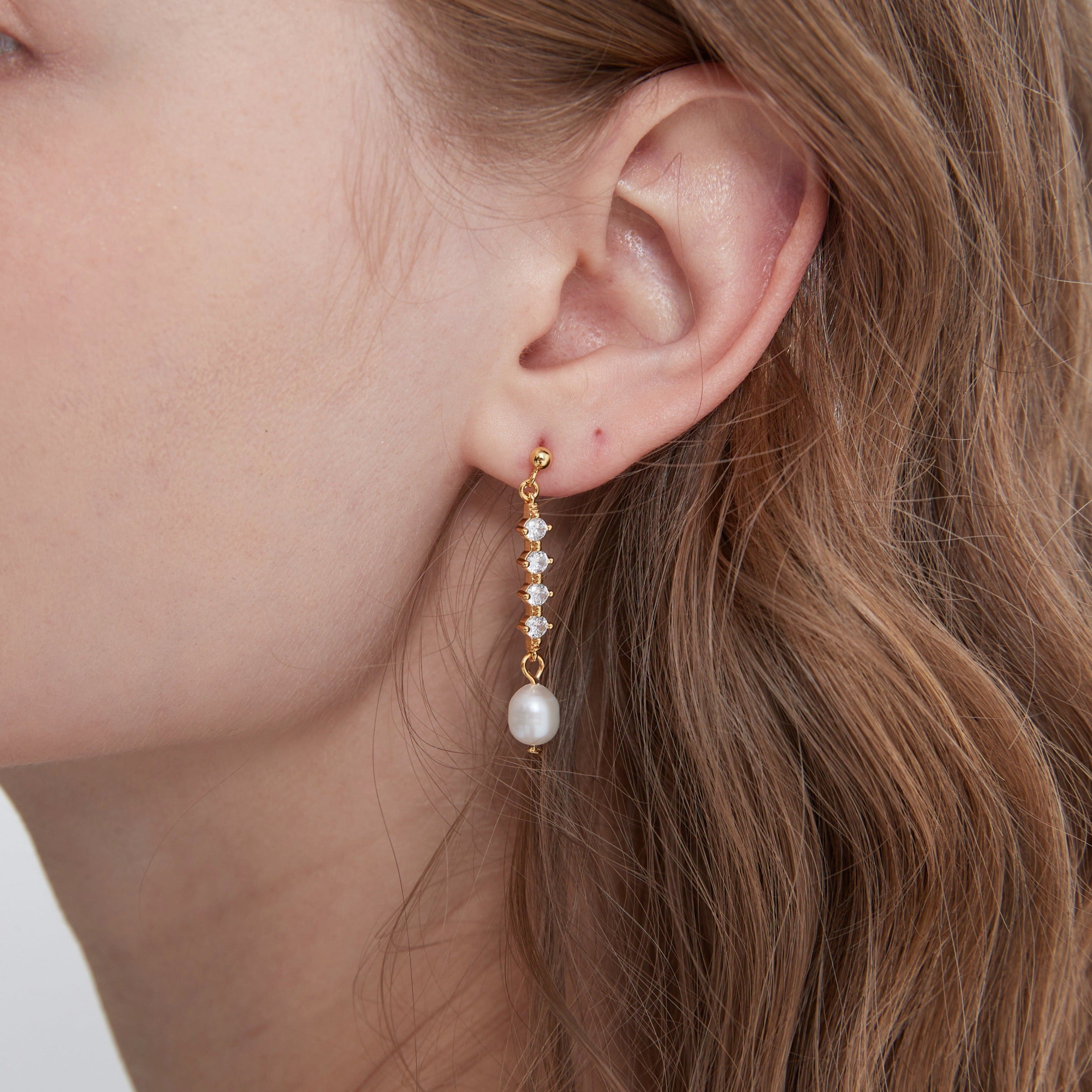 STMG Freshwater Pearl Drop Earrings in gold on ear