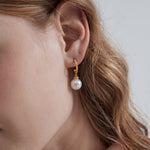 STMG Pearl Dangle Earrings on ear