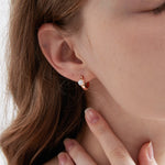 STMG Natural Pearl Hoop Earrings on ear