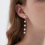 STMG Natural Pearl Dangle Earrings on ear