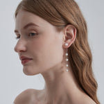 STMG Natural Pearl Dangle Earrings in silver on ear