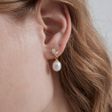 Butterfly Pearl Dangle Earrings on ear