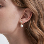 Butterfly Pearl Dangle Earrings on ear