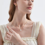 STMG Mother of Pearl Flower Necklace on neck