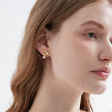 STMG Natural Pearl Daisy Stud Earrings on ear