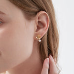 STMG Natural Pearl Daisy Stud Earrings on ear