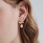 STMG Natural Baroque Pearl Flower Dangle Earrings on ear