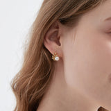 STMG Natural Pearl on Olive Leaf Stud Earrings in gold on ear