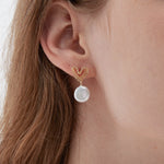 STMG Natural Pearl Dangle Heart Earrings on ear