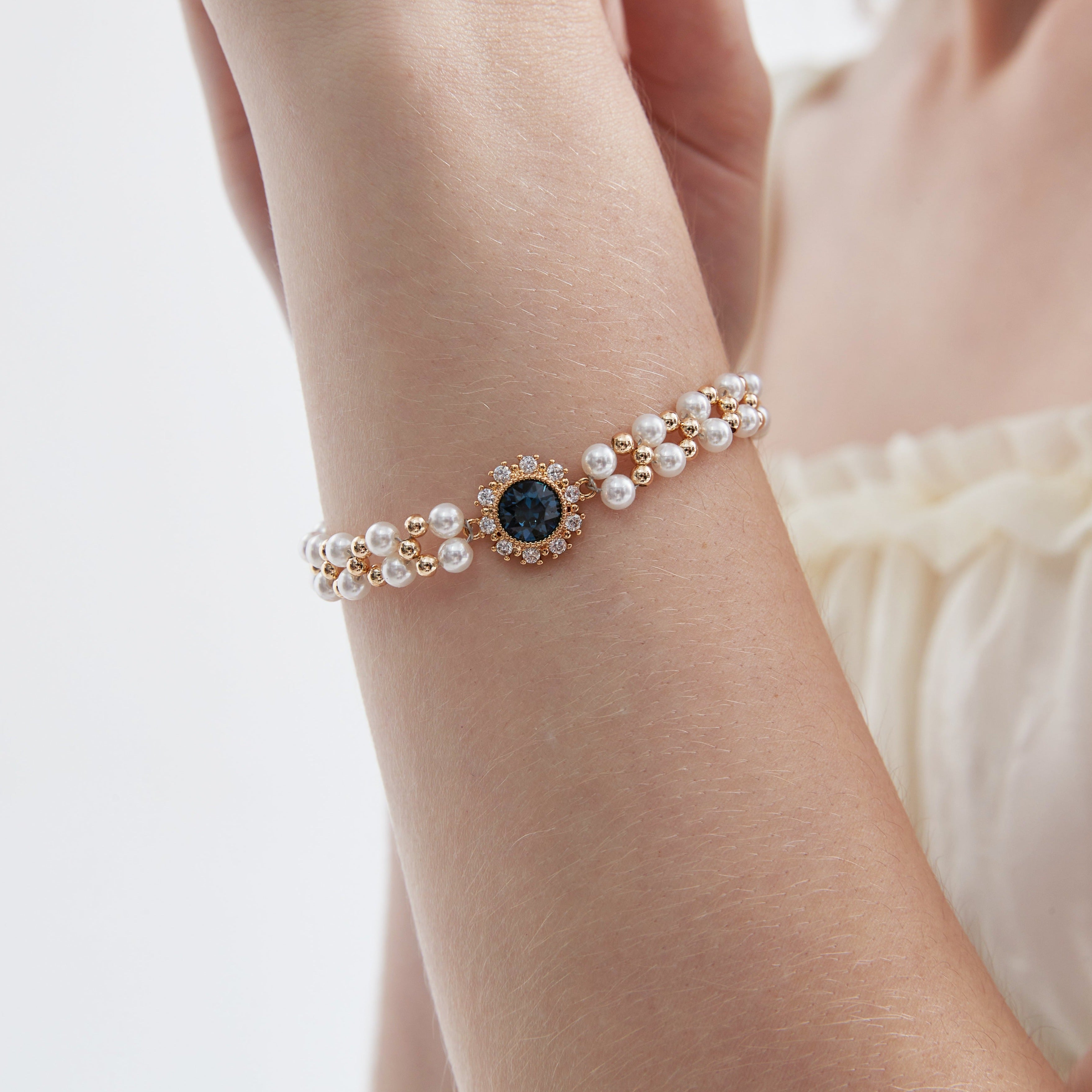 STMG Pearl with Sapphire Bracelet on hand