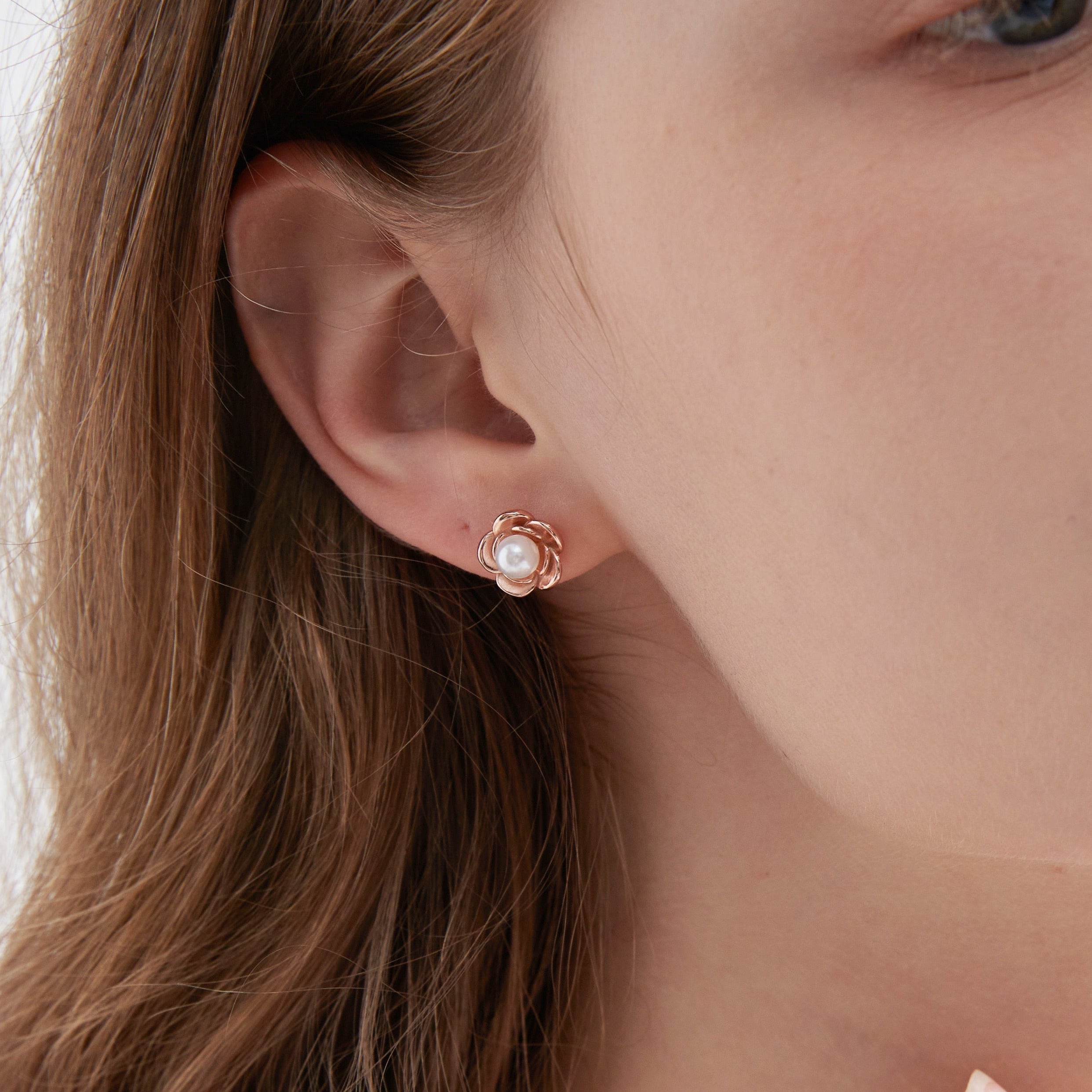 STMG Pearl on Rose Stud Earrings on ear