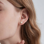 STMG Natural Pearl Stud Earrings on ear