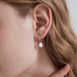 STMG Pearl Dangle Hoops in silver on ear