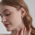 STMG Pearl Stud Earrings on ear