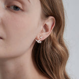 STMG Pearl Stud Earrings on ear