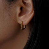 STMG Oval Rectangular Hoops in gold on ear