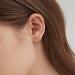 STMG Sun Stud Earrings in gold on ear