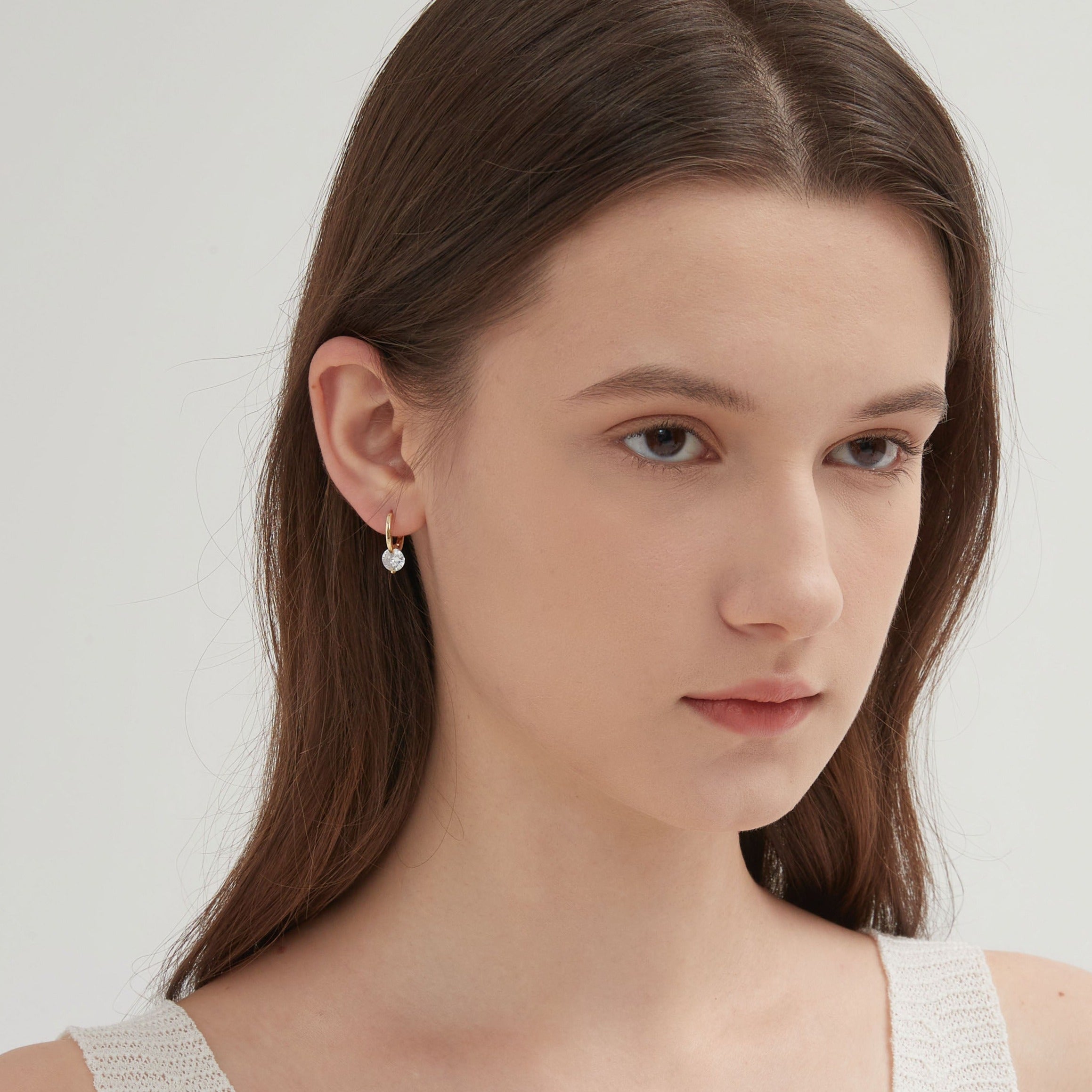 STMG Sparkly Crystal Hoops in gold on ear