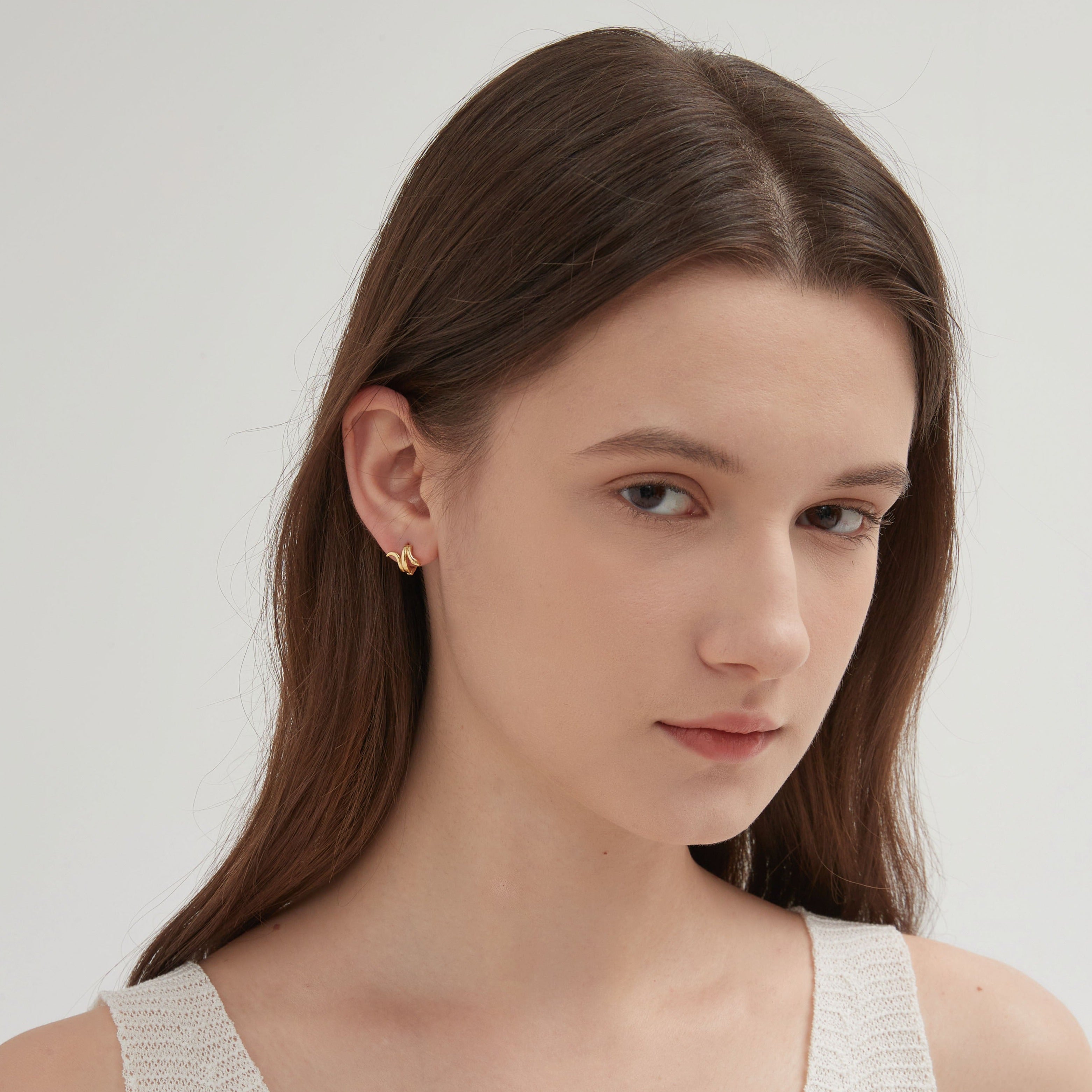 STMG Snake Hoops in gold on ear