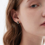 STMG Heart Stud Earrings on ear